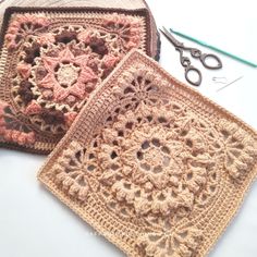 two crocheted squares are sitting next to each other