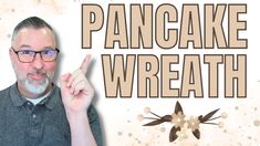 a man with glasses pointing at the camera and text pancake wreath above him that says, pancake wreath