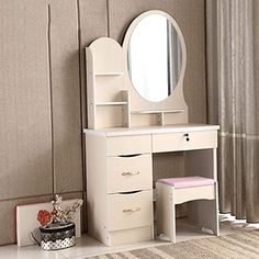 a white dressing table with mirror and stool