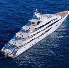 a large white boat floating on top of the ocean