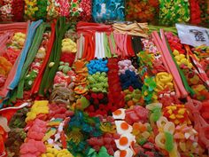 many different colored candies on display for sale