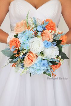 a bride holding a bouquet of flowers in her hands