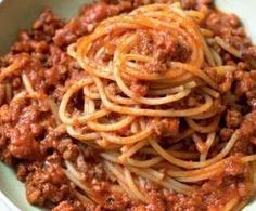 spaghetti with meat sauce in a white bowl