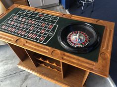 a wooden table topped with a rouleet and a game on top of it