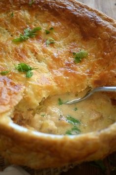 a close up of a pie with a spoon in it