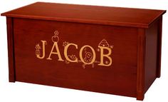 a wooden box with the word jacob on it