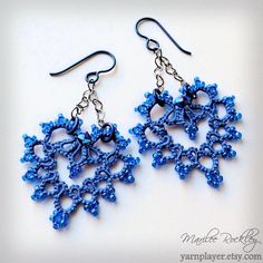 the earrings are made with blue beads