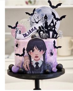 there is a cake decorated with an anime character on the top and bats around it