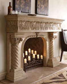 an ornate fireplace with candles lit in it