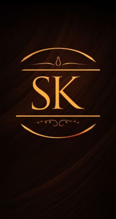 the logo for sk is shown on a dark background with gold foil and swirls