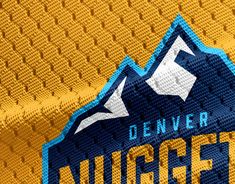 the denver nuggets jersey is shown in blue and yellow