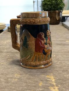 a coffee mug with an image of jesus and mary on the inside is sitting on a kitchen counter