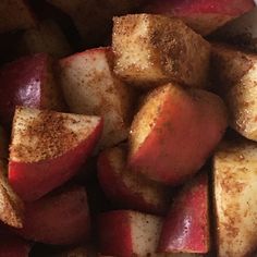 there is a white bowl filled with apples and cinnamon on the side, ready to be eaten