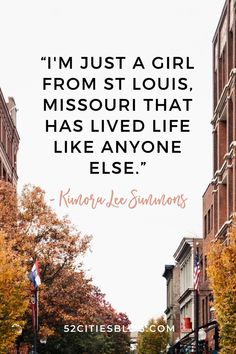 a city street with tall buildings and trees in the background that says i'm just a girl from st louis, missouri that has lived life like anyone else