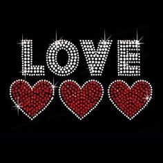 the word love is made up of hearts and sparkles on a black background, with red