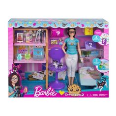 the barbie doll plays with her toys