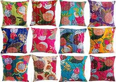 a bunch of colorful pillows sitting on top of each other