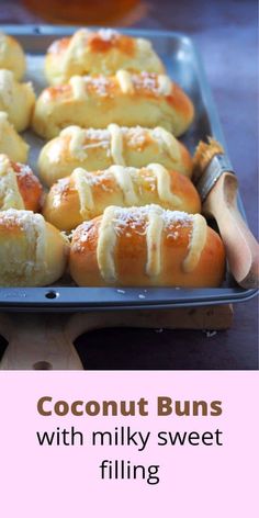 there are many buns that have been made with milky sweet filling on them and the words coconut buns written in large letters