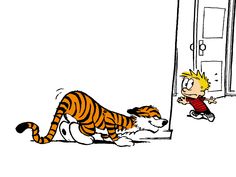 a child is looking at a cartoon tiger laying on the ground next to an open door