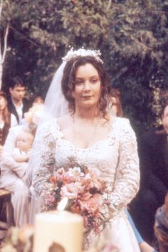 a bride and groom walking down the aisle