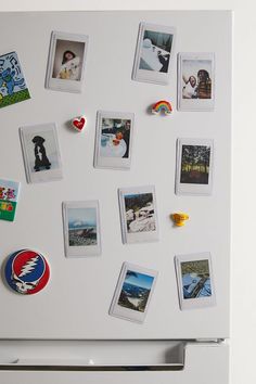 a refrigerator with magnets and pictures on it