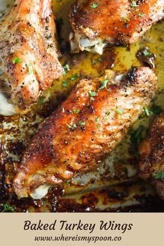 baked turkey wings in a pan with herbs