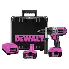 the pink cordless drill is next to its case