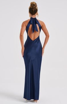 Here's to the nights you will remember because of the fits you won't forget. You will be unforgettable in Etta, our luxe maxi made from bias cut satin that skims beautifully over the body. The dress is completely backless with a high neck and an oversized tie neck detail. Elevate any look with Etta, platform heels and a sleek knot.   Colour: Navy.  Luxury bias cut satin.  High neckline.  Backless detail.  Skims over the figure.  Flares gently at the hem.  Maxi length.  Model is an XS and is wear Homecoming Dresses Corset, Be Unforgettable, Navy Blue Bridesmaids, Midi Dress Wedding Guest, The Nights, Maxi Dress Sale, Rust Dress, Sparkle Dress, Grad Dresses