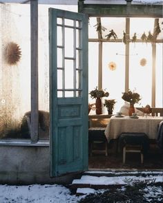 an open door leading into a dining room