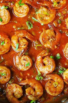 a pan filled with cooked shrimp and sauce