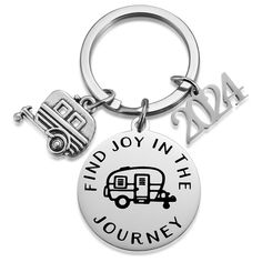 a keychain with the words find joy in the journey and an rv on it