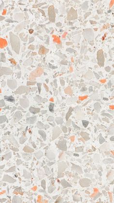 an orange and gray stone floor with small rocks