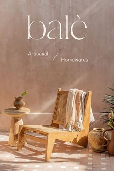 a wooden chair sitting on top of a tiled floor next to a potted plant