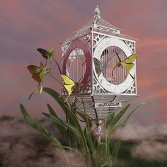 a birdcage with flowers in the foreground and a pink sky behind it