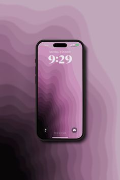 a cell phone with the time displayed on it's screen and an abstract background