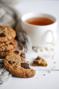 chocolate chip cookies next to a cup of tea