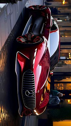 a futuristic looking car hanging off the side of a building