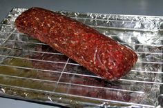 a piece of meat sitting on top of tin foil