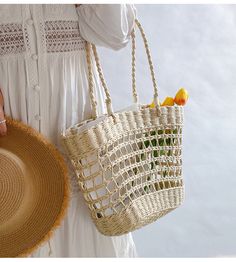 An artisanal basket of hand-woven straw basket bag. Perfect for this summer! Shoulder or top handle carry. Its light weight and durable construction make it ideal for carrying items for a day at the beach or a special event. Show off your style and make a statement with this unique tote bag. Size: 37cm wide opening x 25cm tall (14in x 10in) Designer Style ID: 8439 Eco-friendly Open Weave Straw Bag For Summer, Casual Summer Braided Bucket Bag, Casual Braided Straw Bucket Bag, Casual Braided Bucket Bag For Summer, Casual Braided Bucket Bag For The Beach, Braided Bucket Bag For Vacation, Vacation Braided Bucket Bag, White Bohemian Open Weave Straw Bag, Casual Beach Season Crochet Basket Bag