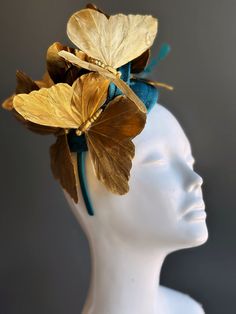 Step into a world of enchantment with our butterfly fascinator in a combination of gold and teal. This fascinator is adorned with delicate gold butterflies that evoke a sense of ethereal elegance, making you a captivating presence at any tea party or themed event!


Age Group/Gender - Adult/Women

Size/Type - One size fits all adults

Color - Teal Gold

Butterfly Material - Feather

Accent Material - Paint Butterfly Fascinator, Masquerade Mask Costume, Mardi Gras Kid, Kids Party Packs, Ethereal Elegance, Tea Party Hats, Wedding Fascinators, Fascinator Hat, Masks Masquerade