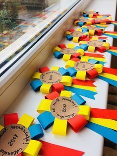 colorful ribbons are lined up on the window sill