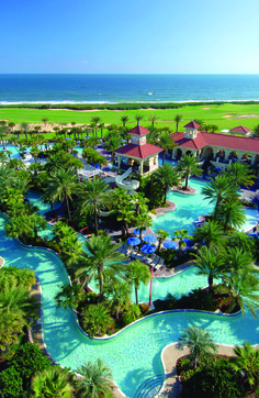 an aerial view of the resort and pool area