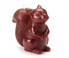 a small red squirrel candle holder on a white background