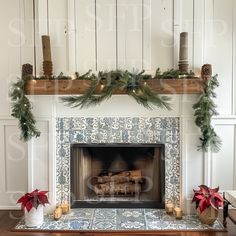 a fireplace decorated for christmas with greenery and candles on the mantel above it