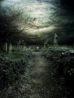 a creepy cemetery with tombstones and trees in the foreground, under a cloudy sky