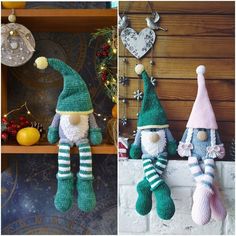 two crocheted gnomes sitting on top of a shelf next to each other