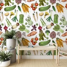 a wall with vegetables painted on it next to a wooden bench and potted plant