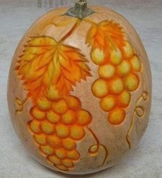 a painted pumpkin sitting on top of a table