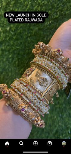 a person is holding several different bracelets on their hand, with the caption new launch in gold plated rajwada