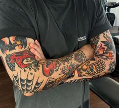 a man with many tattoos on his arms